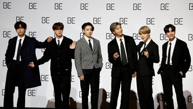 Members of K-pop boy band BTS pose for photographs during a news conference promoting their new album "BE(Deluxe Edition)" in Seoul, South Korea, November 20, 2020. REUTERS/Heo Ran/File Photo